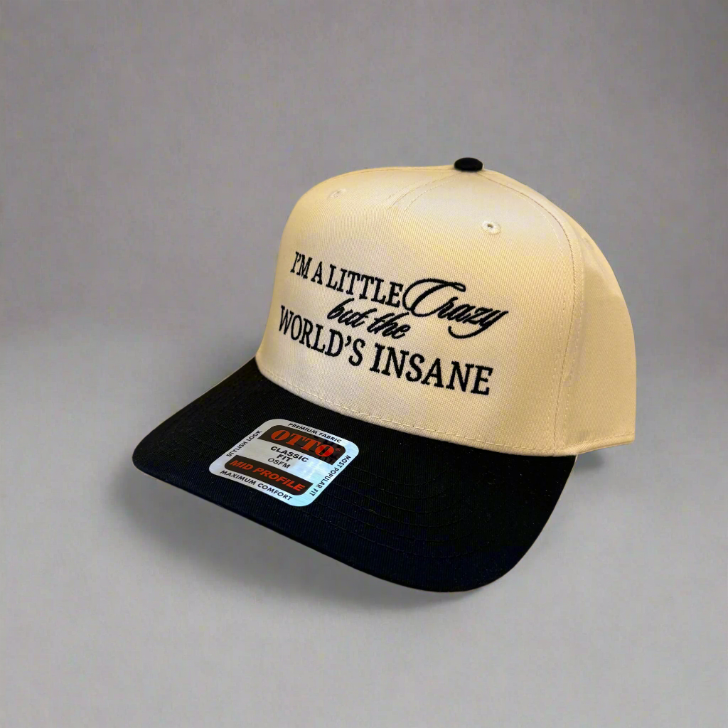 Beige and black cap with embroidered "I'm A Little Crazy"  text 